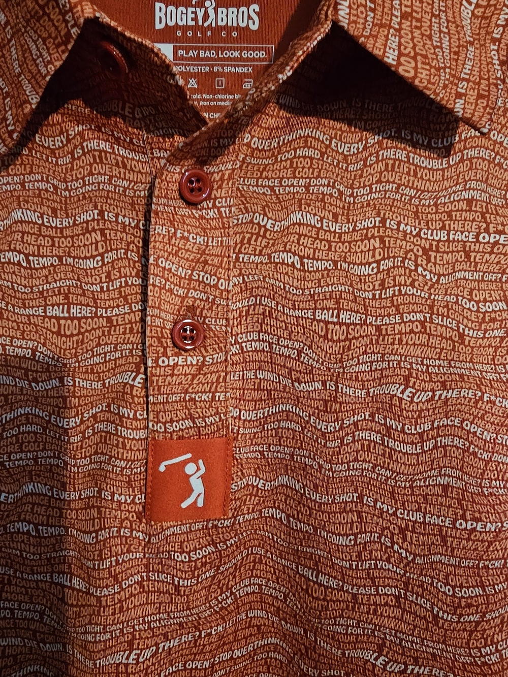 Bogey Bros Orange Short-Sleeve Golf Polo with Allover Text Print